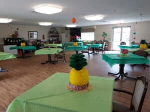 Luau activity table decorations at Edgefield Post Acute